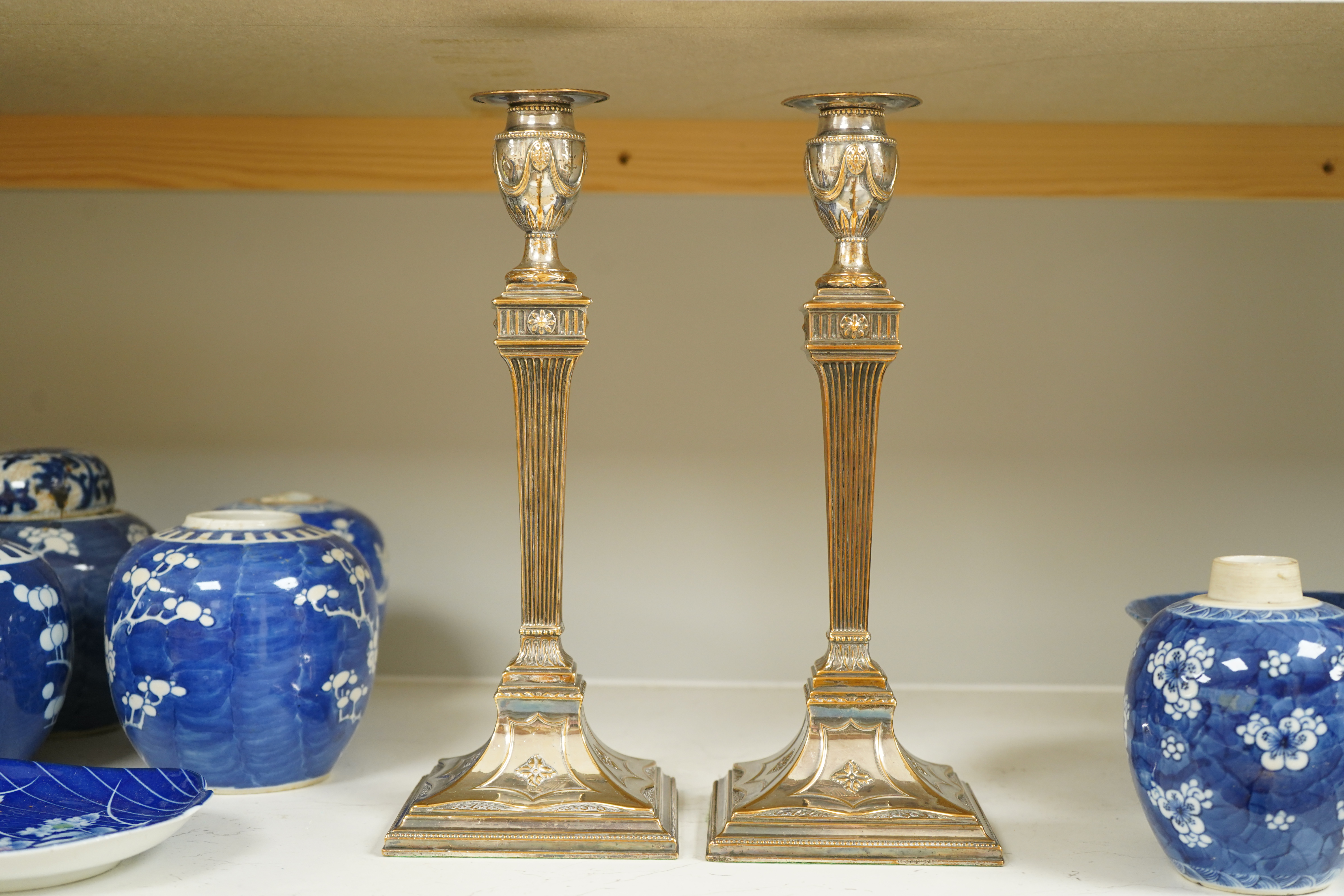 A pair of Adam design silver plated candlesticks, 31.5cm. Condition - worn otherwise good